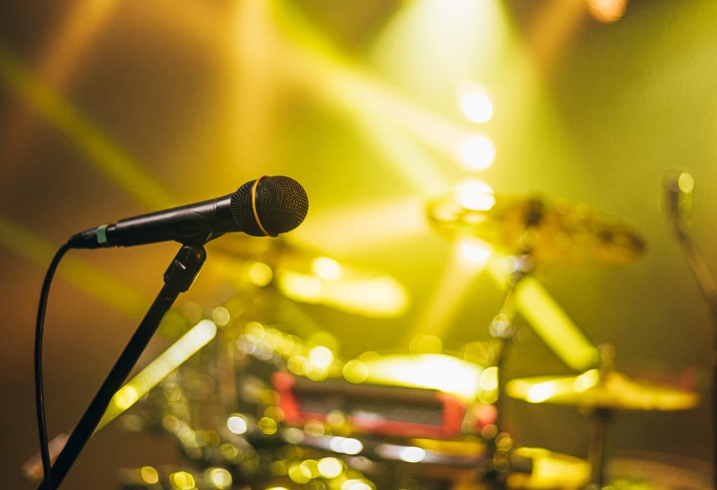 shot-of-a-microphone-standing-on-a-stage-on-a-conc-2023-11-27-05-28-33-utc